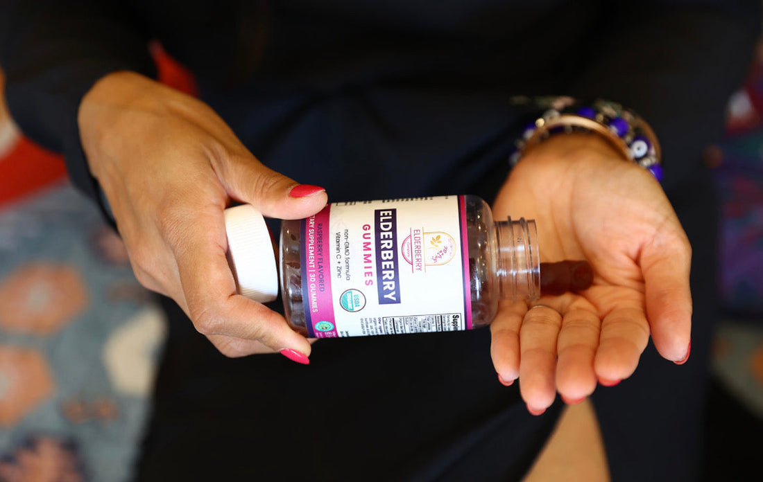 woman holding bottle of elderberry gummies in Arizona