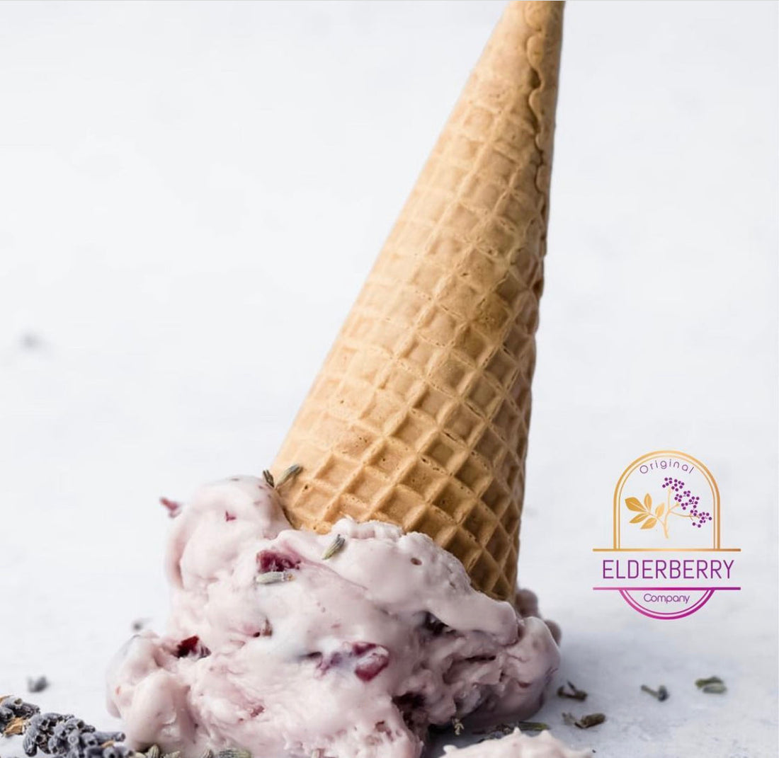 Elderberry ice cream with berries and rose petal garnish