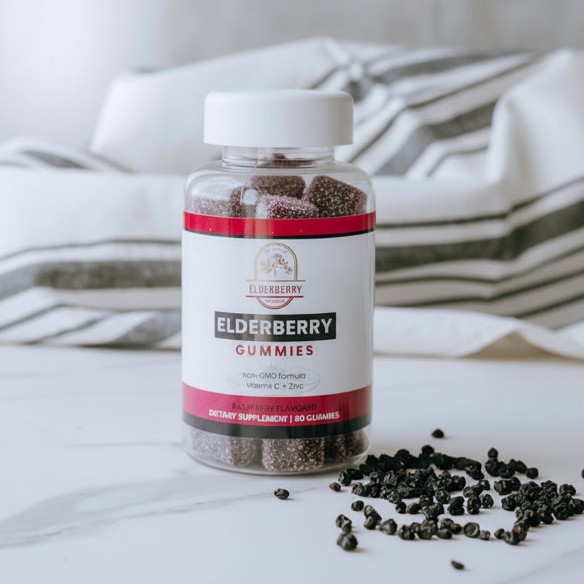Bottle of Elderberry Gummies on a marble surface with scattered gummies.